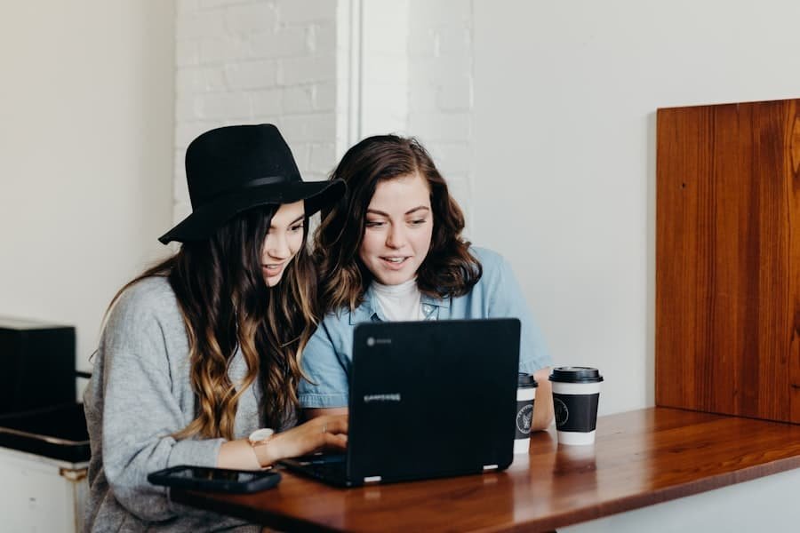 Two Girl Working On Laptop 